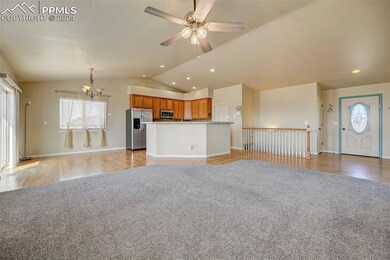 Unfurnished living room with ceiling fan with nota