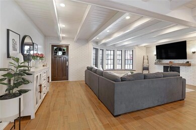 Beautiful, light-filled living area!  Recessed can