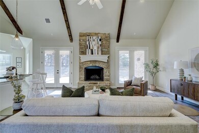 Living room with french doors, light hardwood / wo