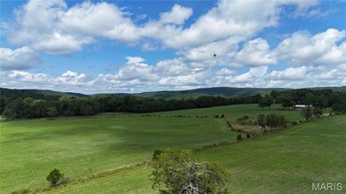 View of mountain background with rural landscape and agricultural land