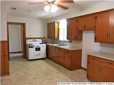 Lots of Cabinets, Counter Tops, and a Window Overl