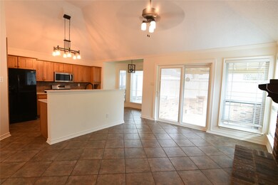 Spacious kitchen and family room with elegant tile