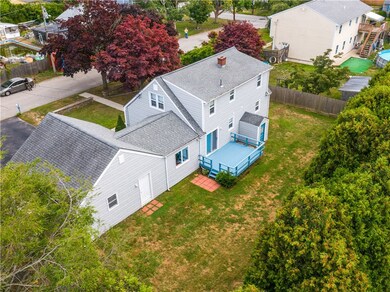 Western side of yard lined with mature Aborvitaes