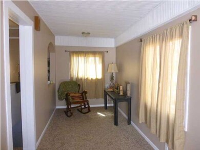 Foyer with built in shelves