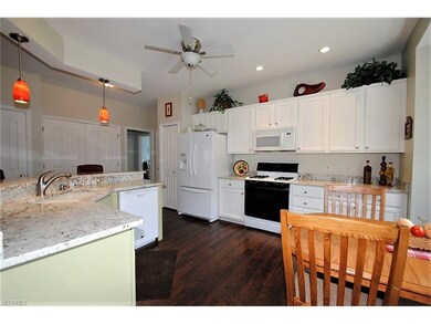 Large cook' kitchen boasts granite counters, white