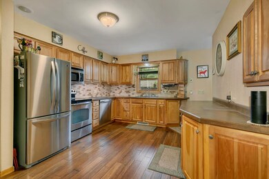 Updated kitchen with birch cabinetry.