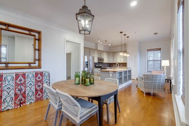 Dining room with an inviting chandelier, rail ligh