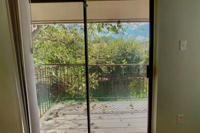 Entryway with view of wooded area