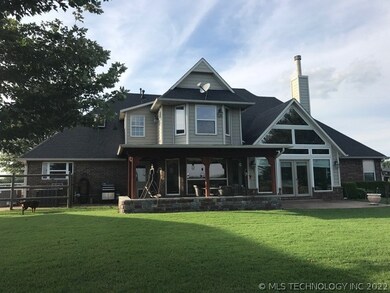 Back of Home with covered Patio.