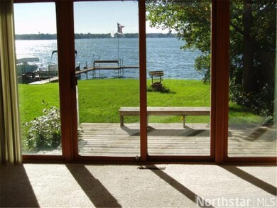 A large patio door in the living room takes in the