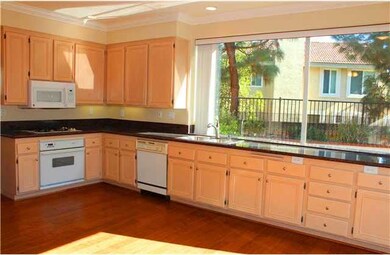 Features include granite slab counter tops, wood c