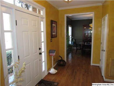Spacious Foyer with hardwood floor, transom window