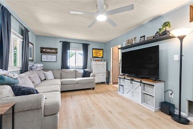 The living room leads to the kitchen.