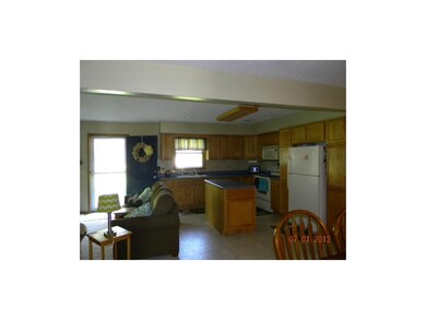 Ton of cabinets plus a kitchen island with built i