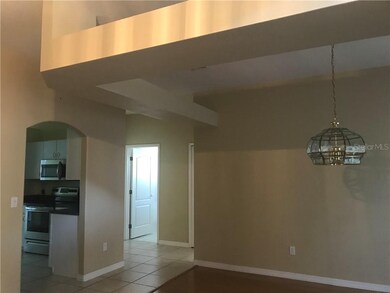View from foyer of formal dining room and kitchen 