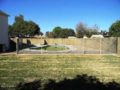 GRASSY YARD AND FENCED POOL