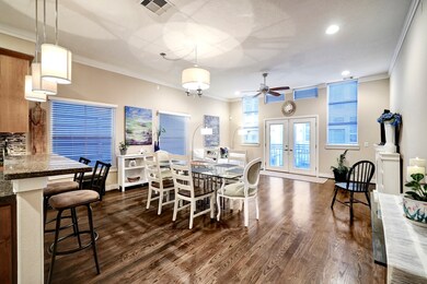 Open floor plan living area with tall ceilings and