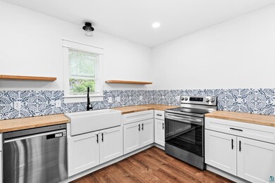 Kitchen featuring stainless steel appliances, butc