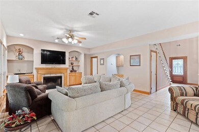 Living room with wood burning fireplace.