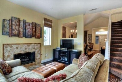 Enjoy the cozy Family Room with custom marble fire