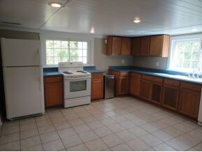 Kitchen has lots of cabinets
