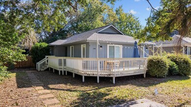 Back of property with a deck