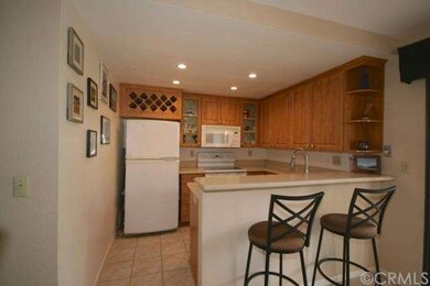 Beautifully remodeled kitchen features cherry cabi