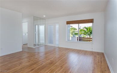 Empty room featuring light wood-style flooring and washer / clothes dryer