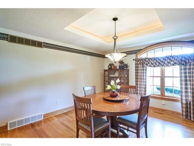 The formal dining has hardwood floors, trey ceiling.