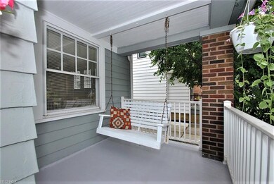 Covered front porch complete with porch swing!