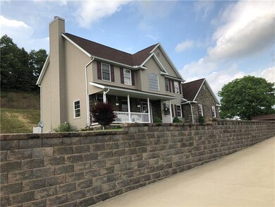 Stone wall and concrete driveway