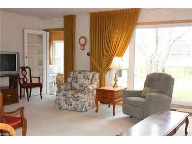LIVING ROOM OPENS TO THREE SEASON ROOM.  YES..HARD