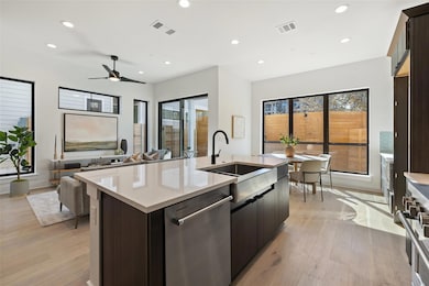 Kitchen with visible vents, a kitchen island with