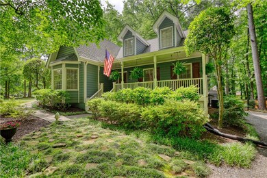 View of front of property with a porch and a shingled roof