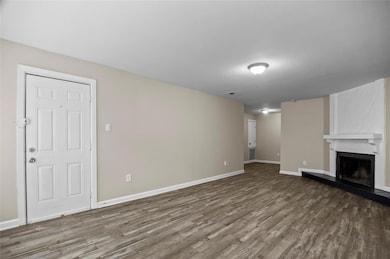 Unfurnished living room with vinyl plank flooring