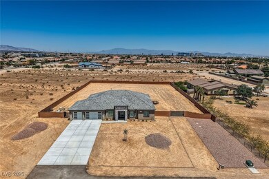 View of front of home with a mountain view, drivew