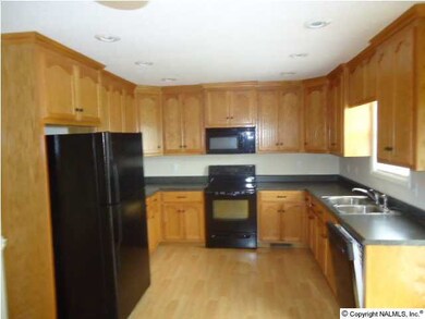 Kitchen with raised panel cabinets and all appliances