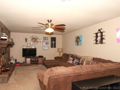 Spacious living with wood burning fireplace, compl