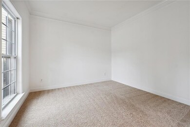 Living room with carpet flooring and double window