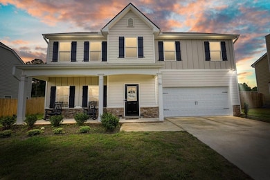 Traditional-style house featuring board and batten