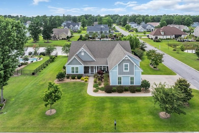 Aerial perspective of suburban area with a nearby body of water