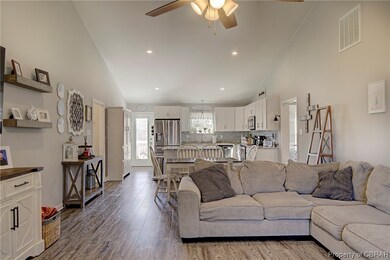 Living room with light hardwood / wood-style floor