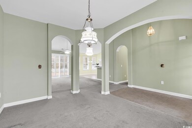 Spare room with carpet floors and ceiling fan
