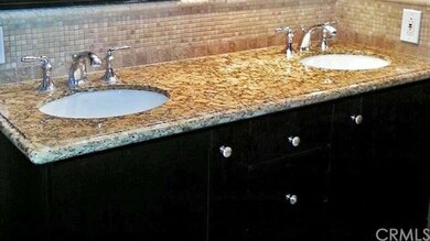 Vanity detail with tile mosaic back splash