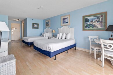 Bedroom featuring light wood-style floors and baseboards
