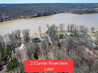 Birds eye view of property with a water view and a