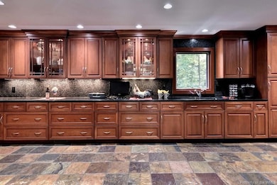 GLASS DOORS; LIGHTED CABINETS; STONE BACKSPLASH; G