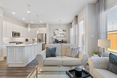 The open-concept living space flows seamlessly int