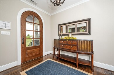 Foyer with wood floors, coat closet