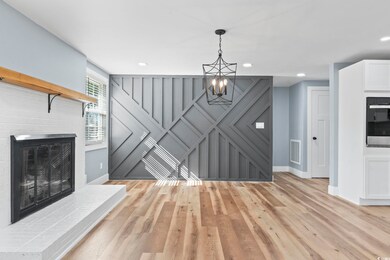 Living room featuring light hardwood / wood-style 